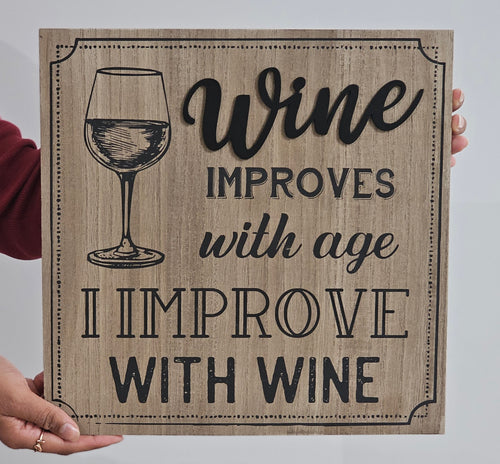 photo of Wooden sign with a wine glass illustration and humorous text